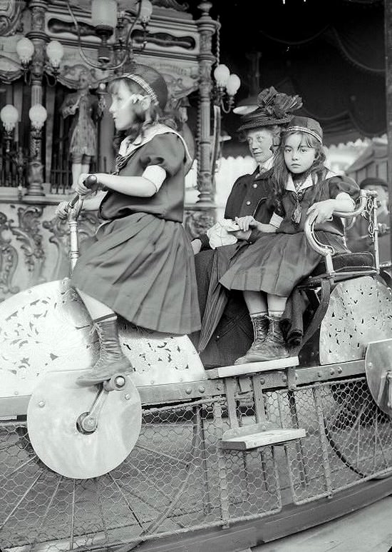 Children ride a unique carousel in Lina Park, Paris, France in 1910.