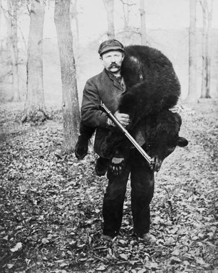A hunter after killing a black bear in the US in 1901.