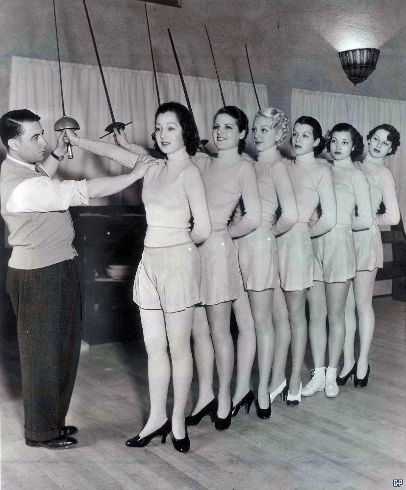 A man prepares chorus girls for a choreographed routine in LA, US in 1950.