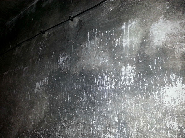Scratch marks of victims on the wall of the Auschwitz gas chamber, 1940-1945