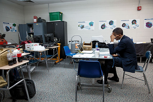 This is Obama in a classroom writing his speech for the memorial service of the victims of the Sandy Hook Elementary School shooting. This is two days after the event in December of 2012.