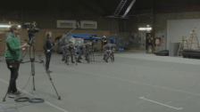 Motion capture actors working on scene for War of the Planet of the Apes, 2016. Filming on a soundstage with a monitor showing live-time how the actors movements will appear in the film.