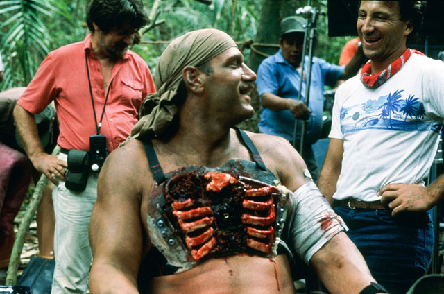 Jesse Ventura with his prostetic to help create his exploding chest death scene in Predator, 1987.