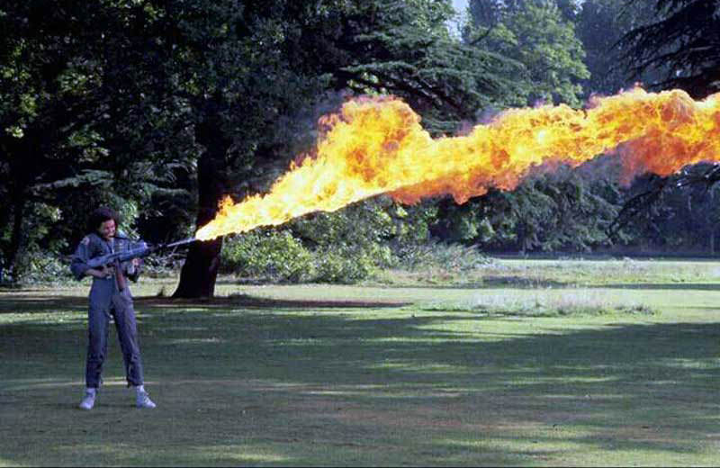Sigourney Weaver practicing with her flamethrower on the lawn at Shepperton Studios 1, Alien 1979.