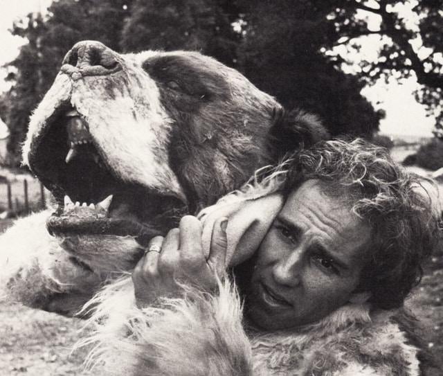 A sweaty crew member emerges from the st. bernard costume on the set of Cujo, 1983.