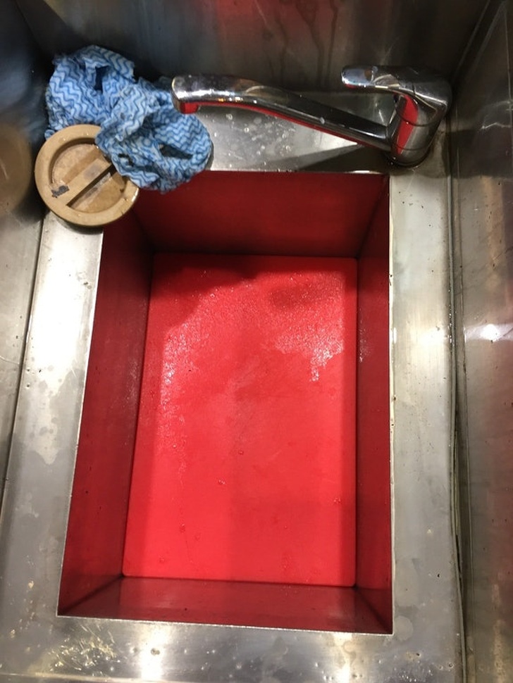 cutting board stuck in sink