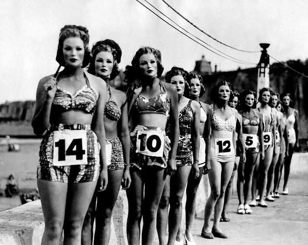 Women all wearing masks for a perfect body beauty contest in CA, US in 1947.