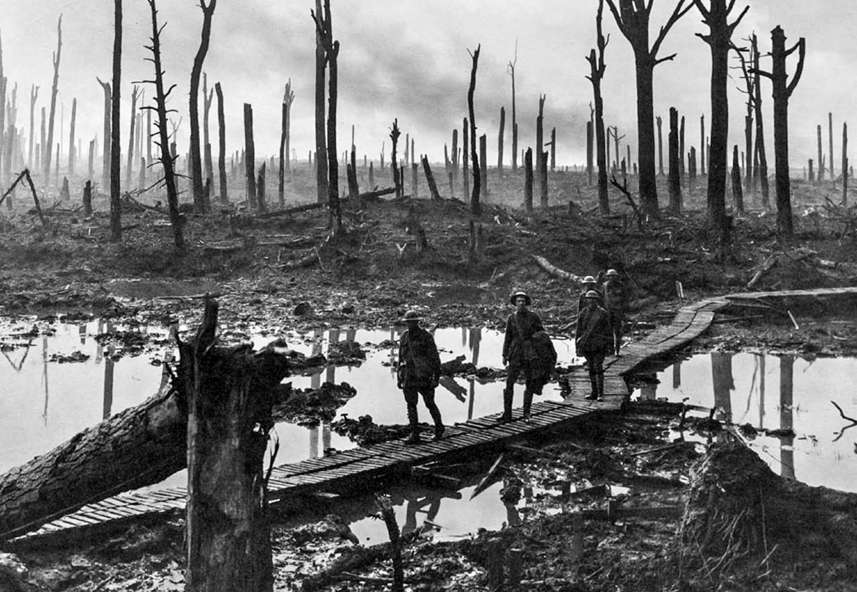 British soldiers cross a small bridge in Belgium in 1916. This area used to be a very thick forest instead of the ominous place of death it looks like in this picture.