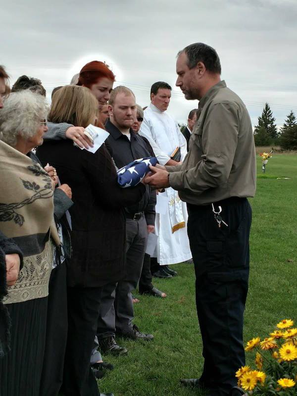 “The halo around my head as a military friend handed us my dad’s flag…”