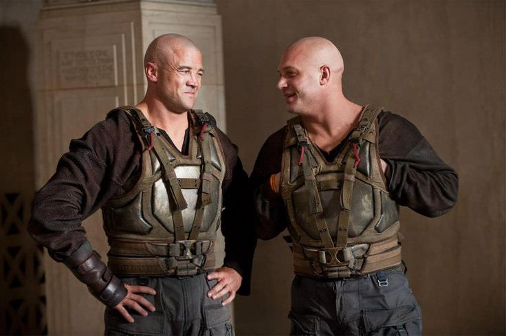 Tom Hardy has a laugh with his stunt double prior to a scene in The Dark Knight Rises (2012).