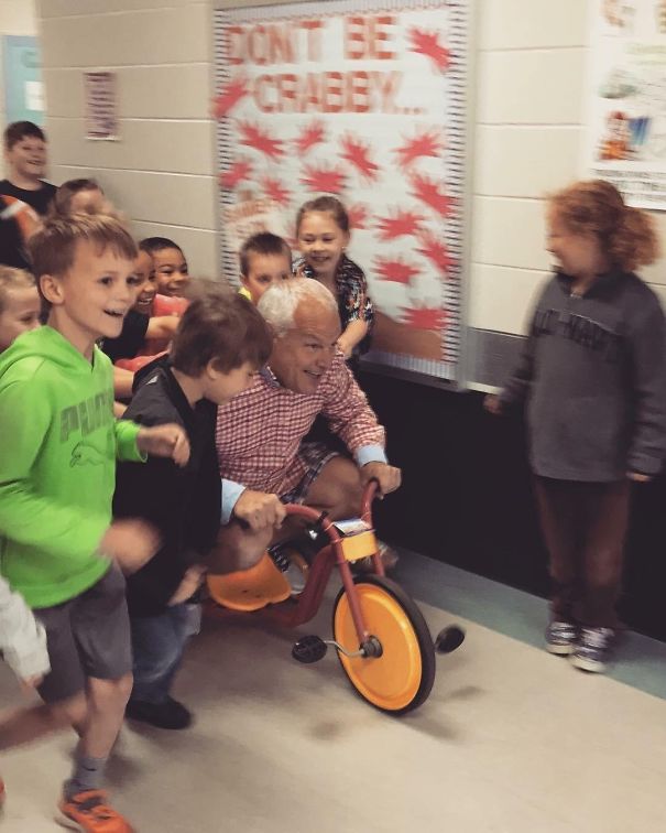My Dad Challenged The Students At The School Where He Is The Principal To Read A Combined 1,000 Minutes. The Reward Would Be Getting To Push Him Down The Hall On A Tricycle While He Wore Mismatched Clothes Inside Out