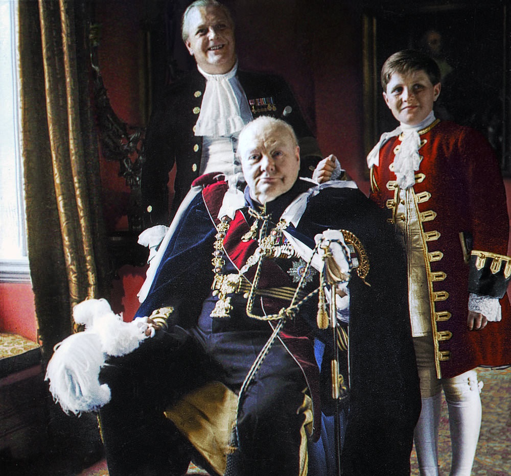 Sir Winston Churchill in his Knight of the Garter robes, his son Randolph, and grandson, Winston. Queen Elizabeth II’s coronation day, 1953.