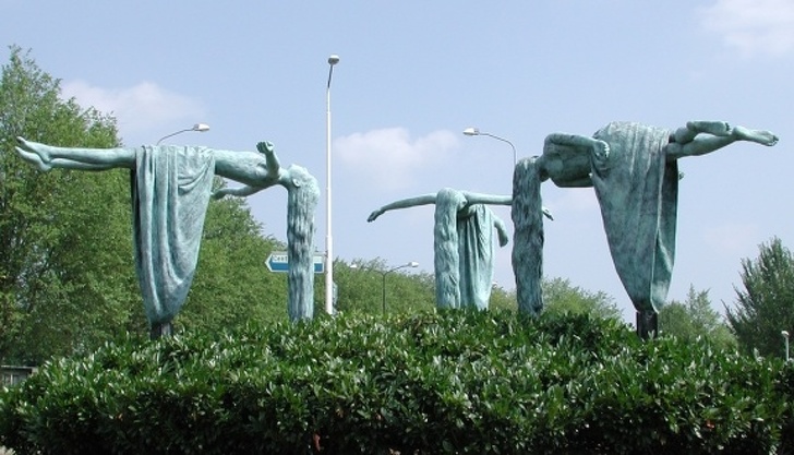 gravity defying statues