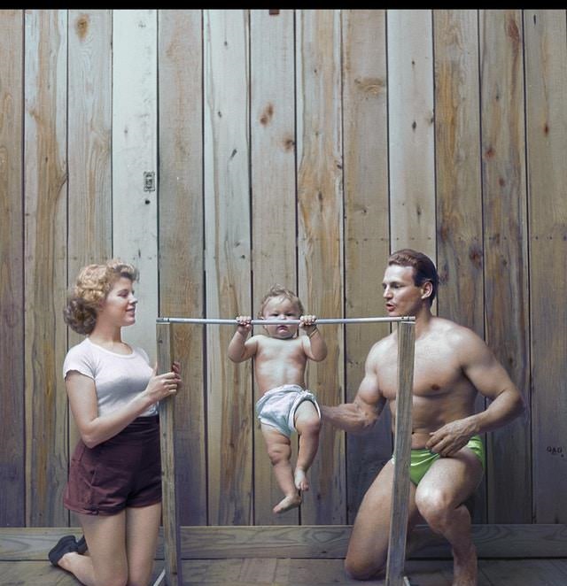Bodybuilder Gene Jantzen with wife Pat, and eleven-month-old son Kent, 1947.