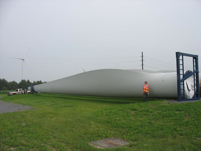 wind turbine blade next to human