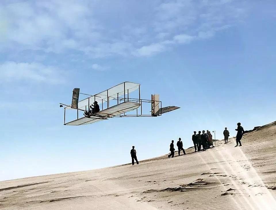 Orville Wright flying a glider over the dunes of North Carolina, 1902.
