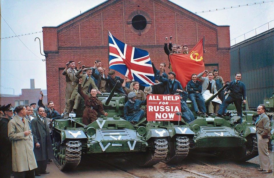 "All Help for Russia Now". Factory workers ride on Valentine Mk2 tanks as they leave a factory in Smethwick, September 22, 1941.