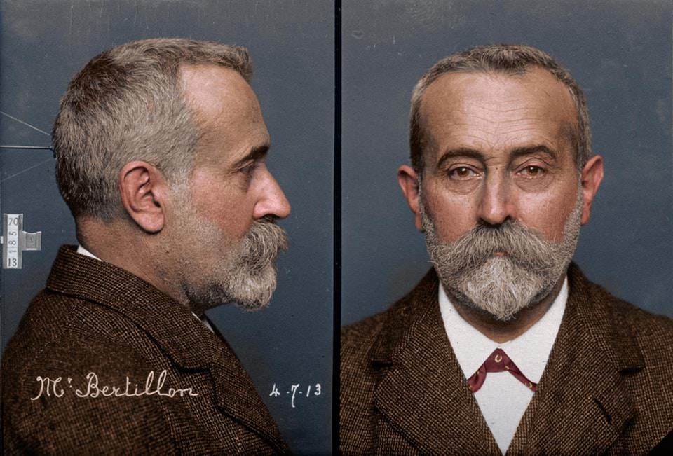 Alphonse Bertillon, in 1913, demonstrating the two-part 'mug shot' method of photographing suspects that he pioneered.