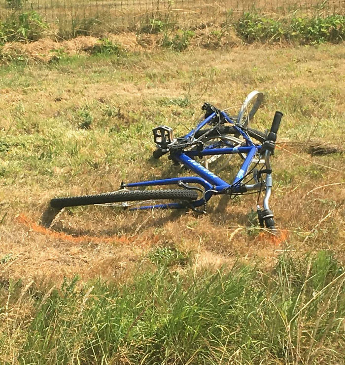 This mangled bicycle was one of only two photos of evidence she could share from the crime scene.