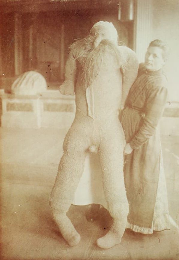 Patient Katharina Detzel showing of the man she built from her own bedding in a mental hospital in Ohio, US in 1910.