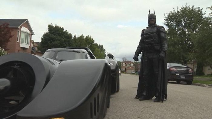 He even has a fully functioning Batmobile