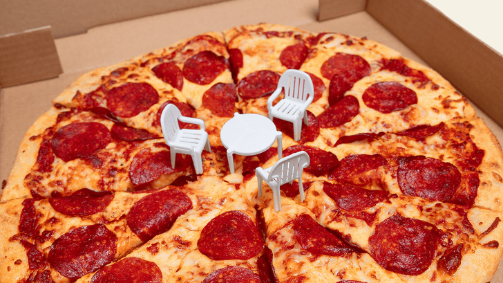 Now sit down and enjoy the pizza.