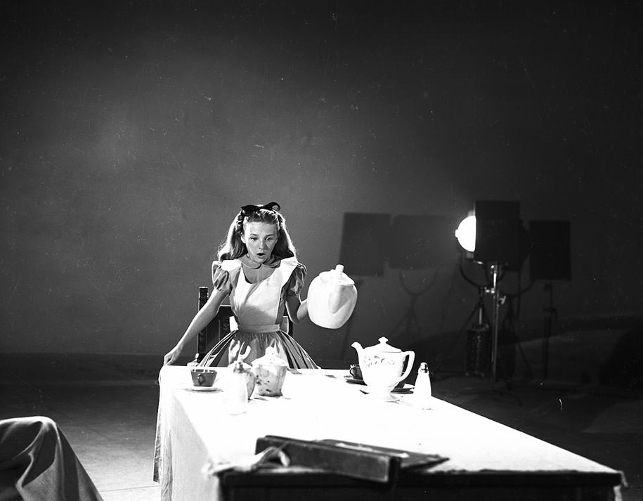 Kathryn Beaumont, who also voiced the title character, acts out a scene for animators for the film Alice in Wonderland (1951).
