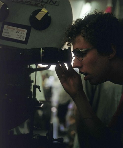 Jon Heder reviewing a camera angle before a scene in Napoleon Dynamite (2004).