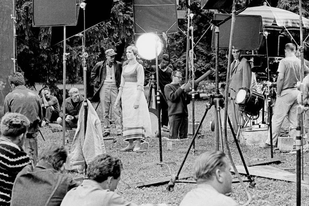 Crew members prepare equipment as Julie Andrews (center) gets ready for a scene in The Sound of Music (1965).