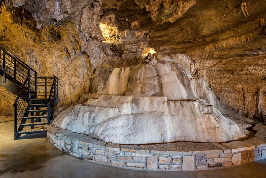 “Inside, Hay followed the cave’s natural, high-roofed contours “The architect was God,” he said”. It even has a natural waterfall inside