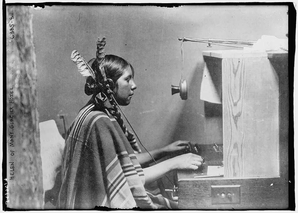 A native Sioux woman works a telephone switchboard at the Many Glacier Hotel in Montana in 1911.