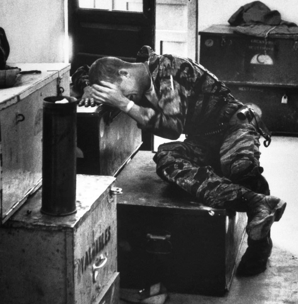 Crew Chief James Forley breaking down shortly after arriving at base when it all hit him at once in Vietnam in 1965. The last 3 pictures were part of a group taken by Larry Burrows who followed the crew into battle and published these in Life Magazine to show the war to the US public.