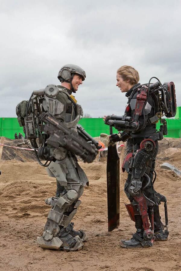 Tom Cruise and Emily Blunt share a laugh during a scene in Edge of Tomorrow (2014).