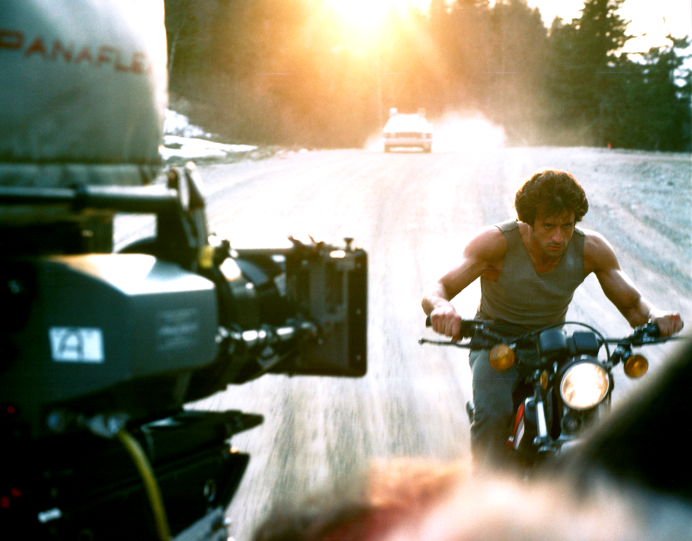 Sylvester Stallone shooting a scene in First Blood (1982).