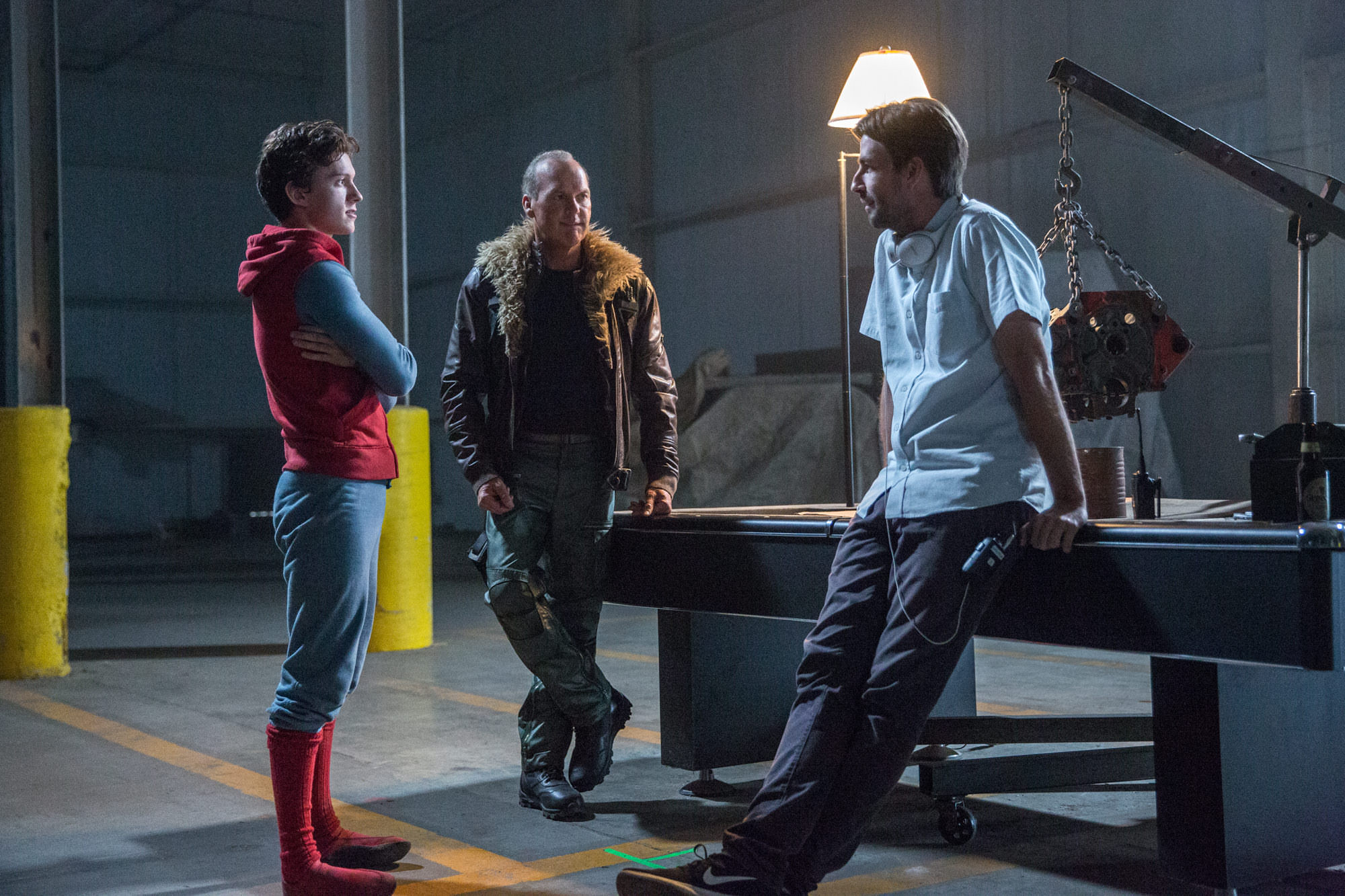 Director Jon Watts prepares Michael Keaton and Tom Holland for a scene in Spider-Man: Homecoming (2017).