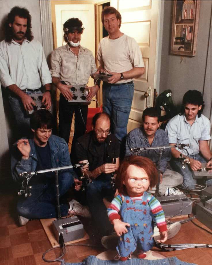All the crew members it took to control the doll chucky take a picture during filimg of Child's Play (1988).