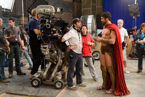 Director Zack Snyder (center) and Gerard Butler prepare for a scene in 300 (2006).