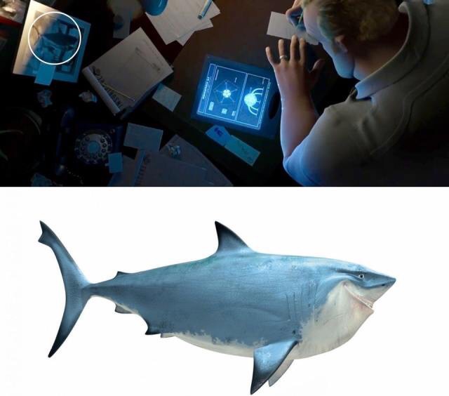 In  The Incredibles, in Bob Parr’s home office, there’s a photo from a  fishing trip where it appears he caught Bruce from Finding Nemo.