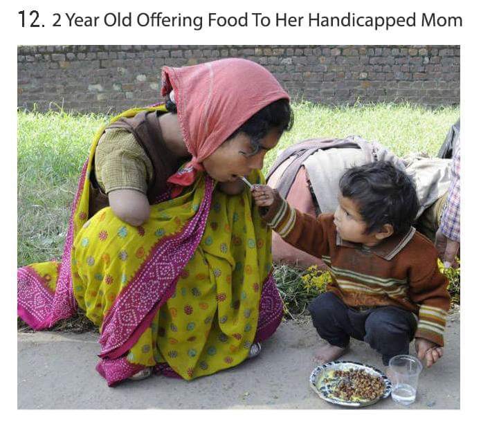 child feeding a poor - 12. 2 Year Old Offering Food To Her Handicapped Mom