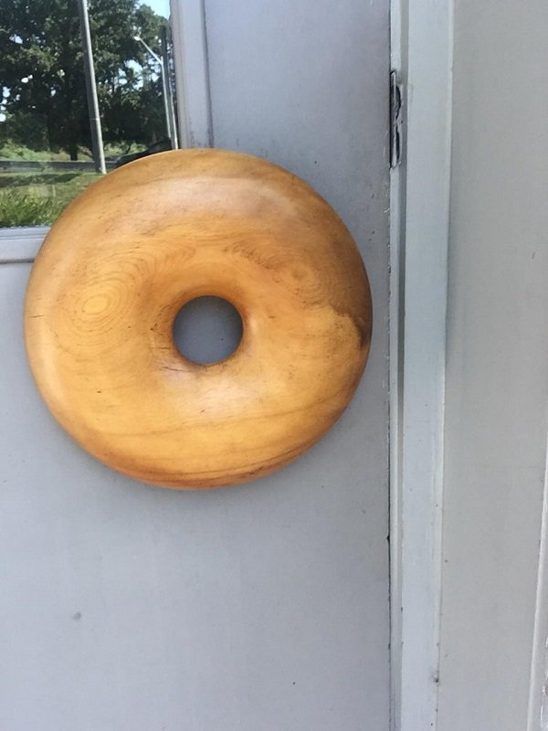 This bagel shop has door handles shaped like massive bagels.