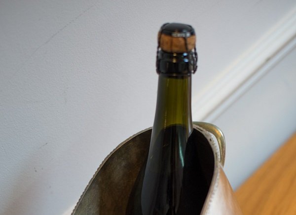 Agraffe: the wired cage that holds the cork in a bottle of champagne.
