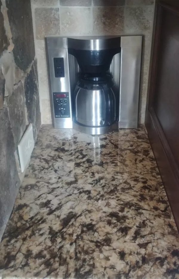 This kitchen has a special coffee maker built right into the walls. Perfectly tucked away and this spot will help keep the pesky clutter out of your life.