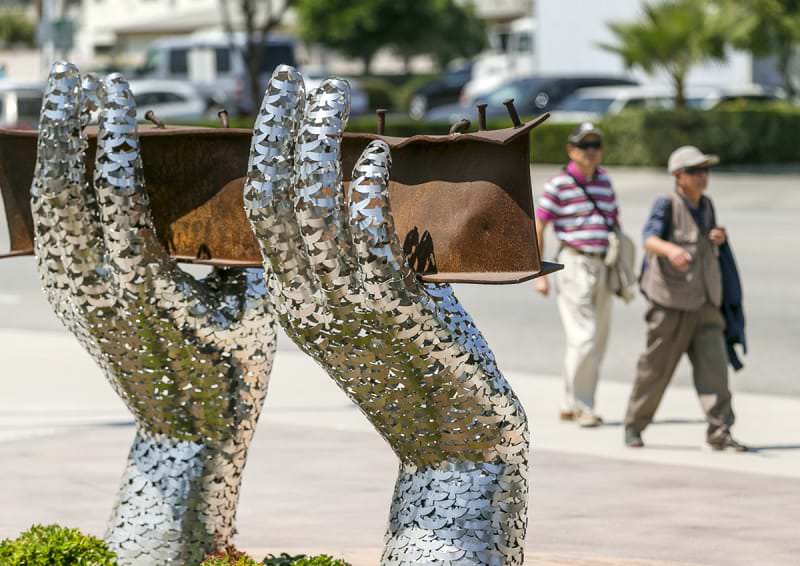 "Reflect" in Rosemead, California.

Heath Satow's sculpture "Reflect" is made with a damaged, rusted L-beam from the collapsed World Trade Center buildings. Each of the two hands are constructed with 2,976 interlocking birds representing the individual victims from the 2001 attacks.