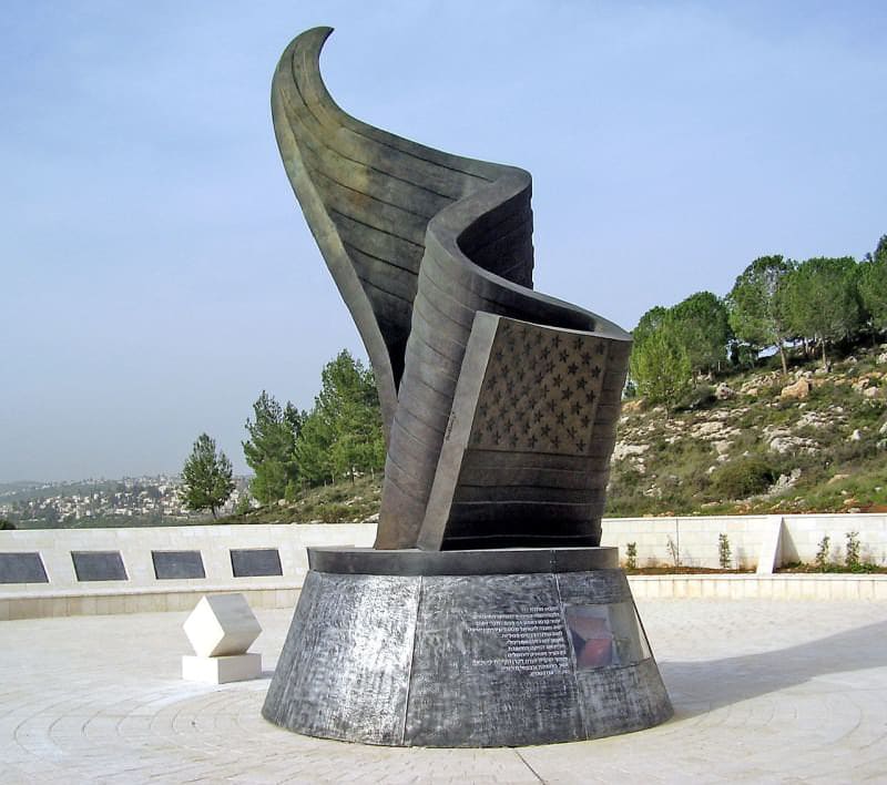"9/11 Living Memorial Plaza" in Ramot, Jerusalem.

This monument measures 30 feet and has been partially forged with recovered steel from the twin towers. Inscribed on the surrounding plaques are the names of those killed in the attacks.