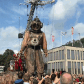 A giant marionette controlled by a group of people