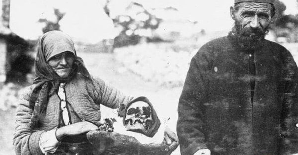 Serbian mother carrying the bones of her son back to their homeland in World War 1