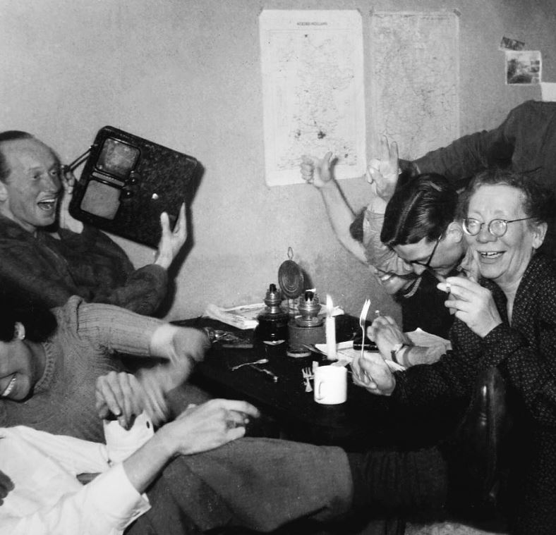 Dutch resistance members celebrate at the moment they heard of Adolf Hitler’s death over the radio, May 1945