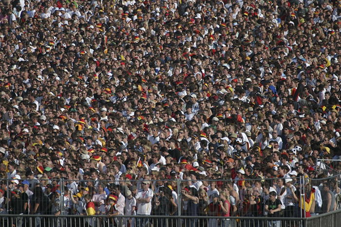 "If you're stuck in a stampede. As soon as you get knocked down your chances decrease significantly. If this is the case, however, and you can’t get up immediately, assume a protective posture with your feet tucked up and your hands covering your head. Try to position your face in the direction the crowd is moving so you don’t get kicked and try to get back on your feet ASAP."