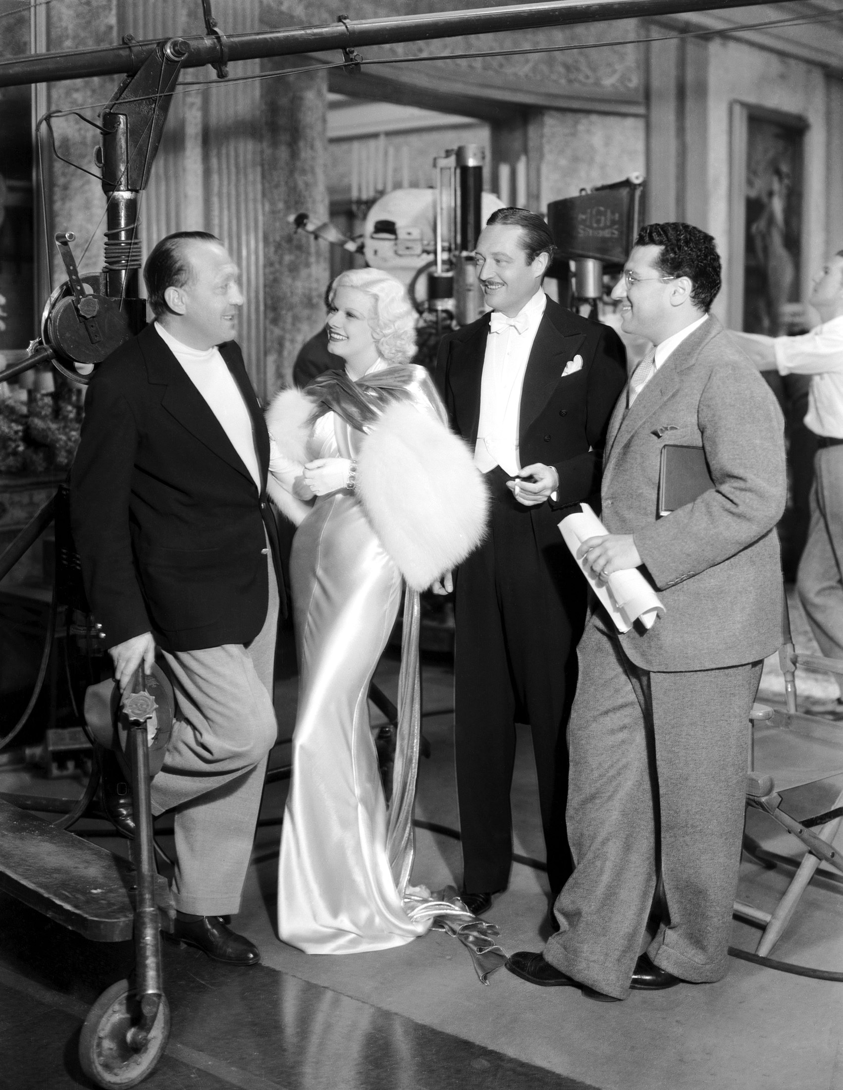 David O. Selznick, Jean Harlow, Edmund Lowe, and Director George Cuko prior to a scene in Dinner at Eight (1933).