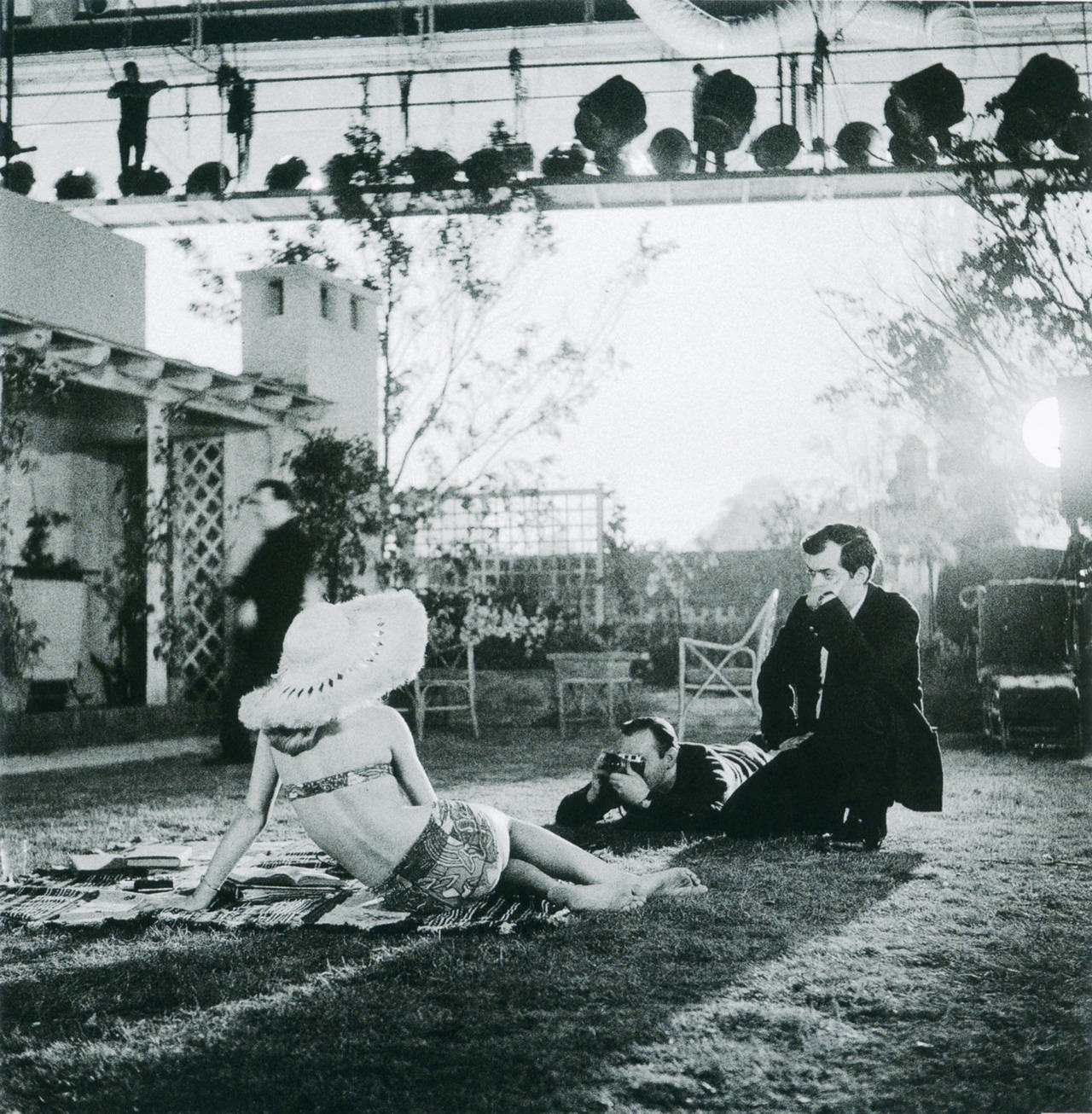Stanley Kubrick (right) and a photographer take a promo picture of Sue Lyon for Lolita (1962).